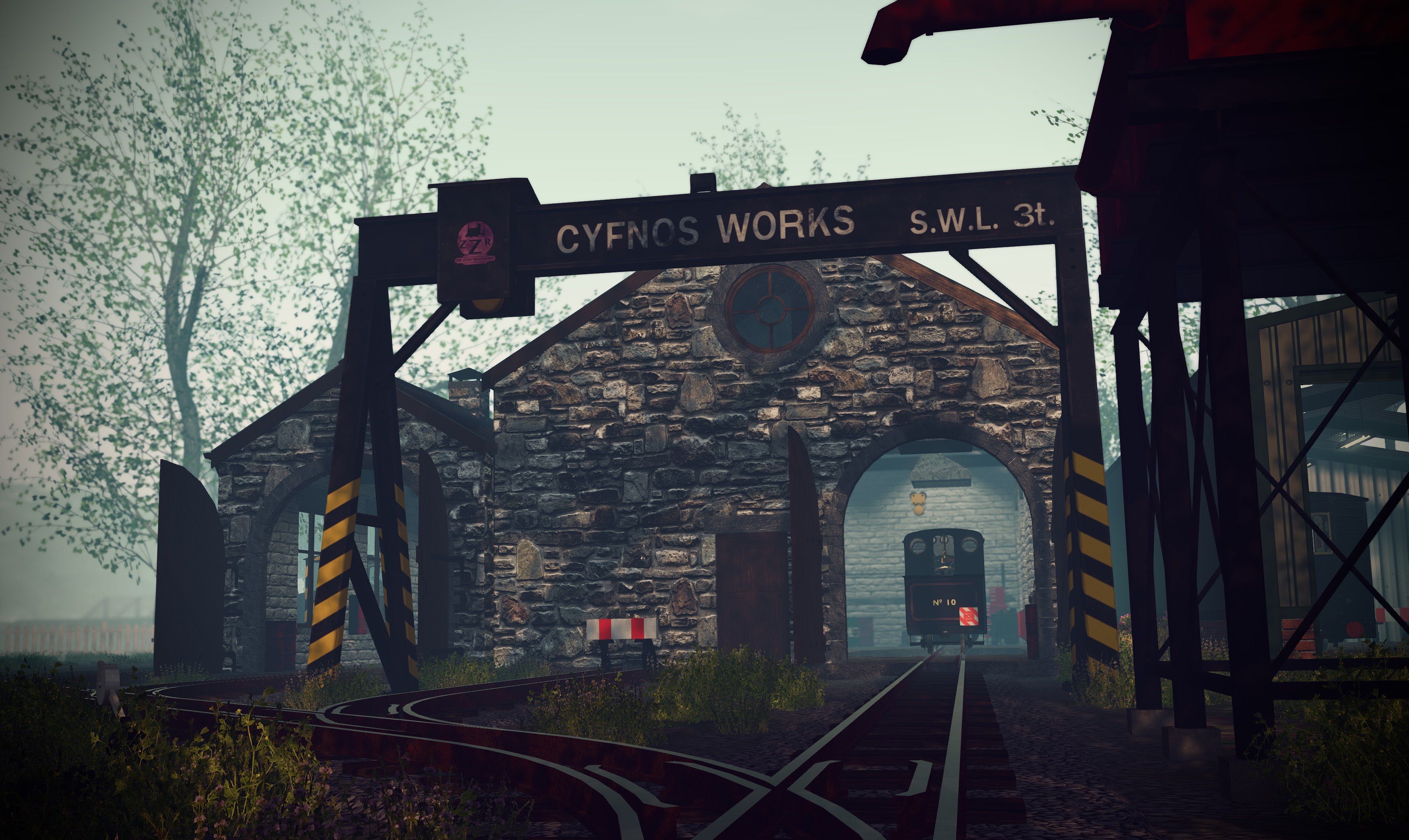 External shot of the Zany Zen Railways works building, a crane is out front saying Cyfnos Works