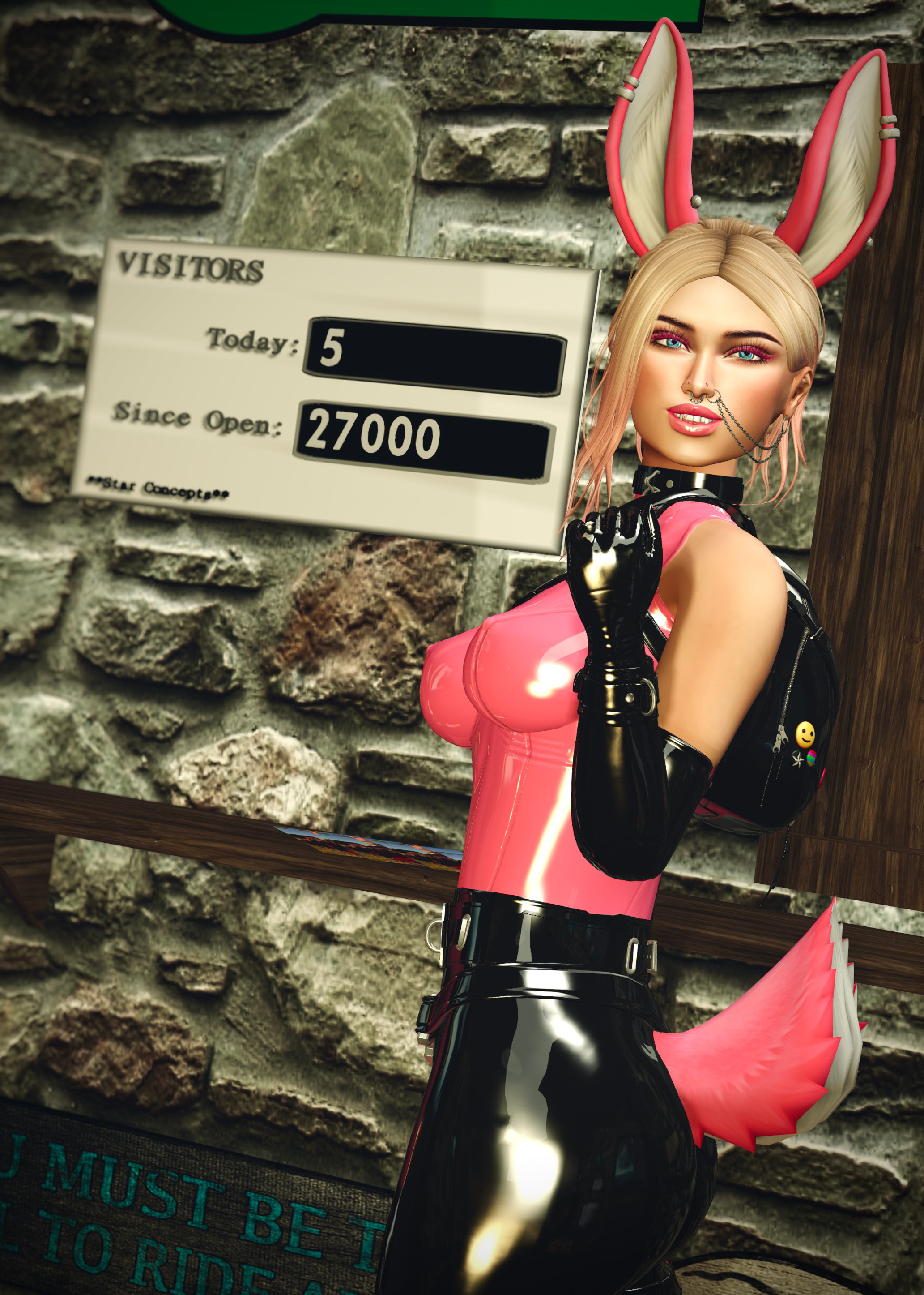 The Zany Zen standing in front of a visitor counter saying 27000 at the Zany Zen Railway station Somdari, pink bunny ears and tail are visible and she is smiling