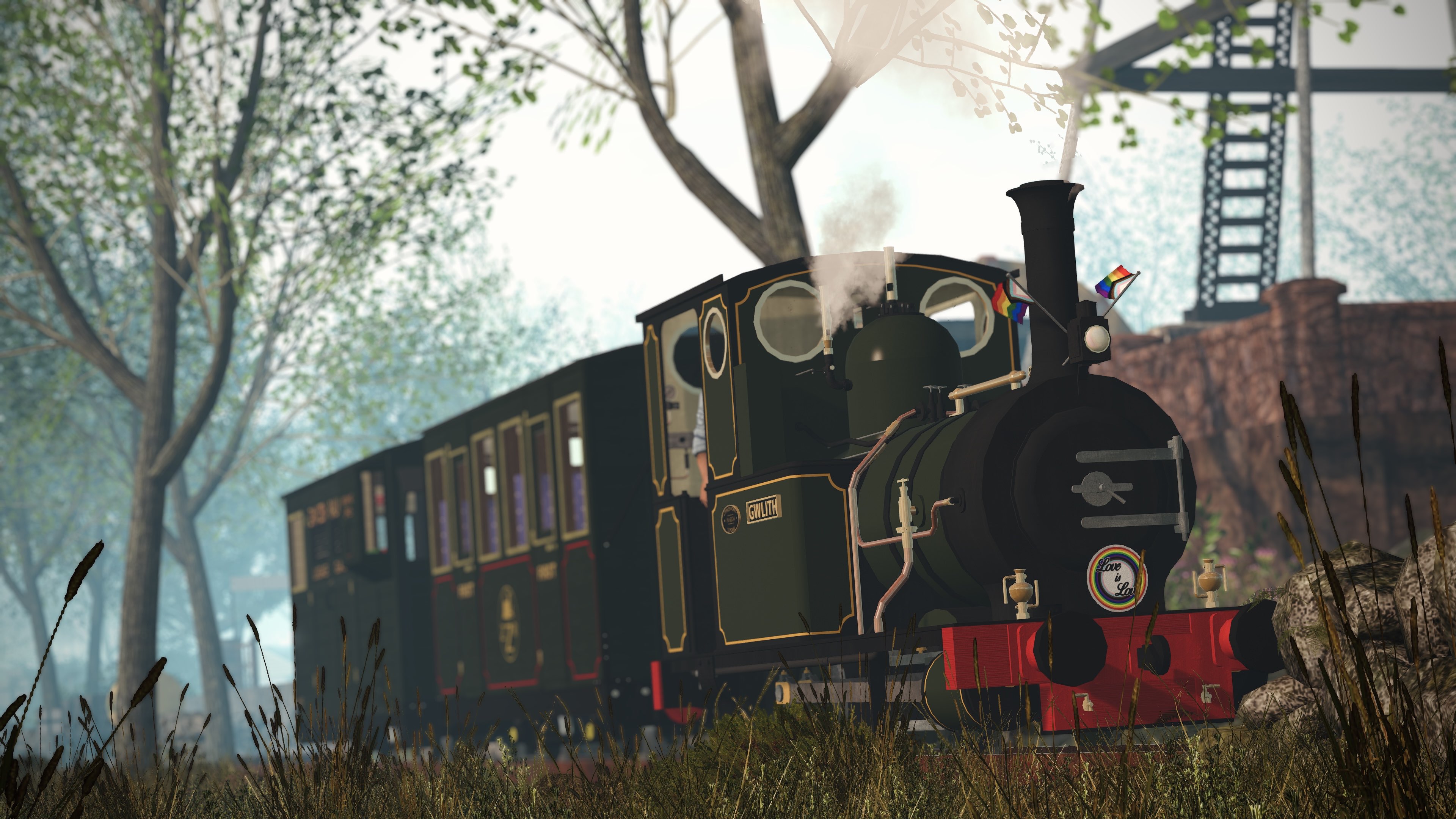 The Zany Zen Railway's steam engine Gwlith running down through Ahndang sporting her beautiful Pride decorations