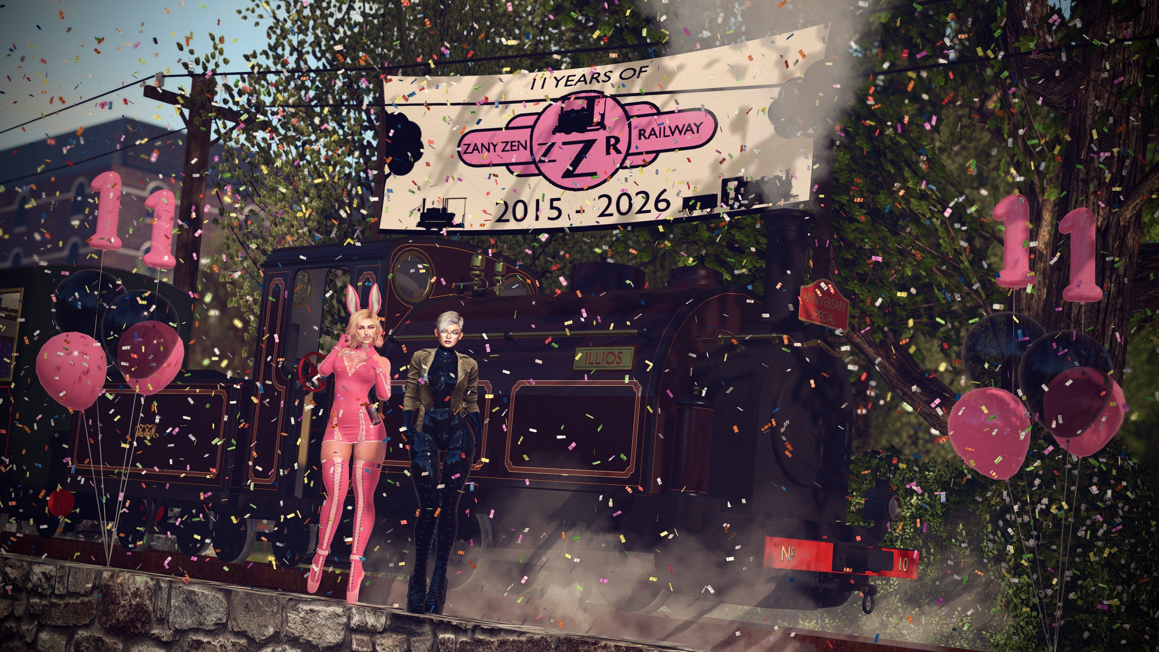 Zen Rabbit and Eesoov Elan standing in front of The Zany Zen Railway locomotive Illios, with a banner behind the loco saying "11 years of Zany Zen Railway, 2015 - 2026", lots of confetti in the air and balloons saying 11.