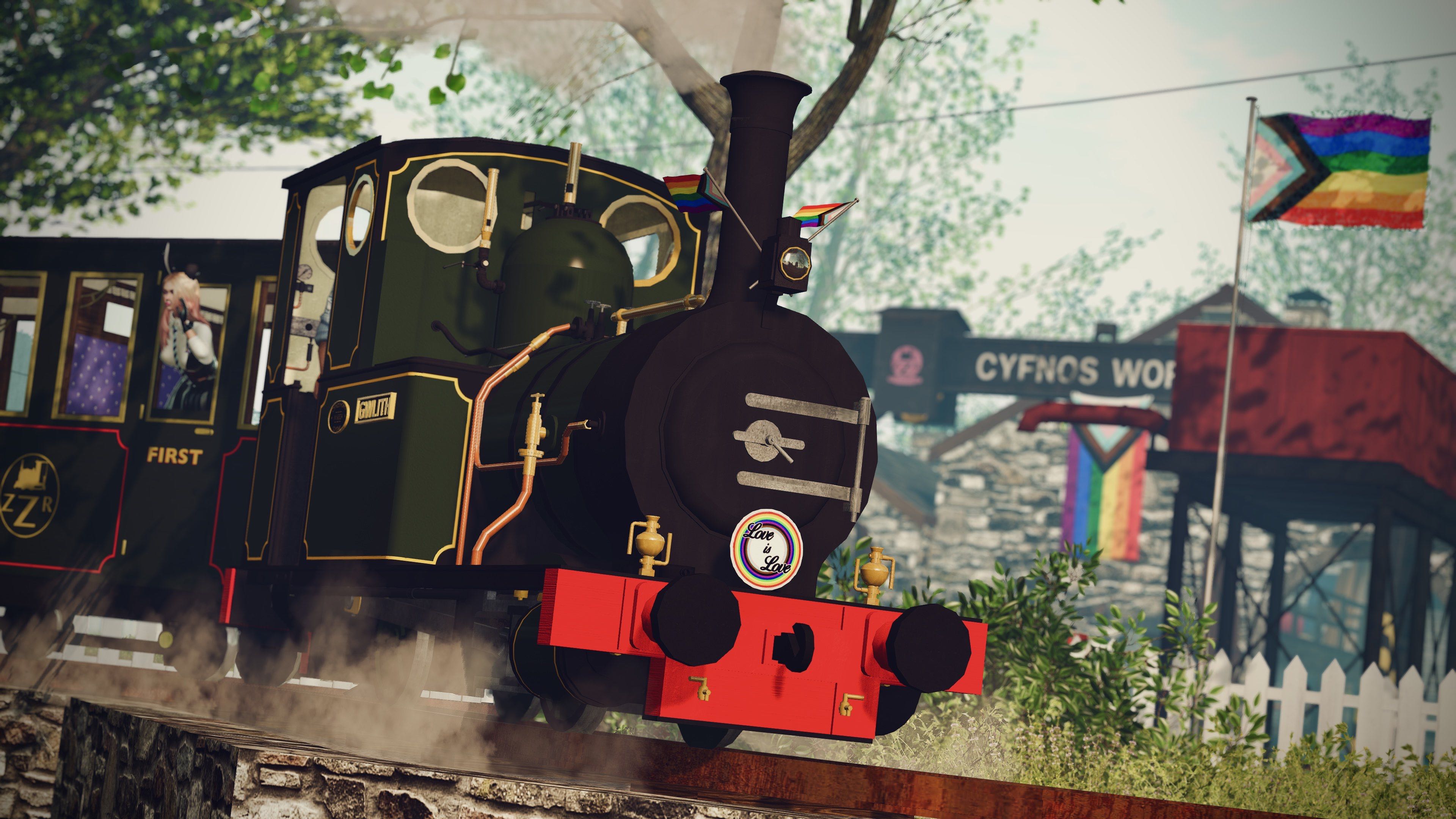 The Zany Zen Railway locomotive Gwlith proudly sporting her pride flags and plaque, while multiple pride flags can be seen in the background, and the Zany Zen can be seen waving while riding in the passenger carriage.